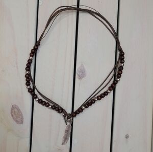 Wood and silver-colored beads and a feather pendant, Vintage-style, 22 in